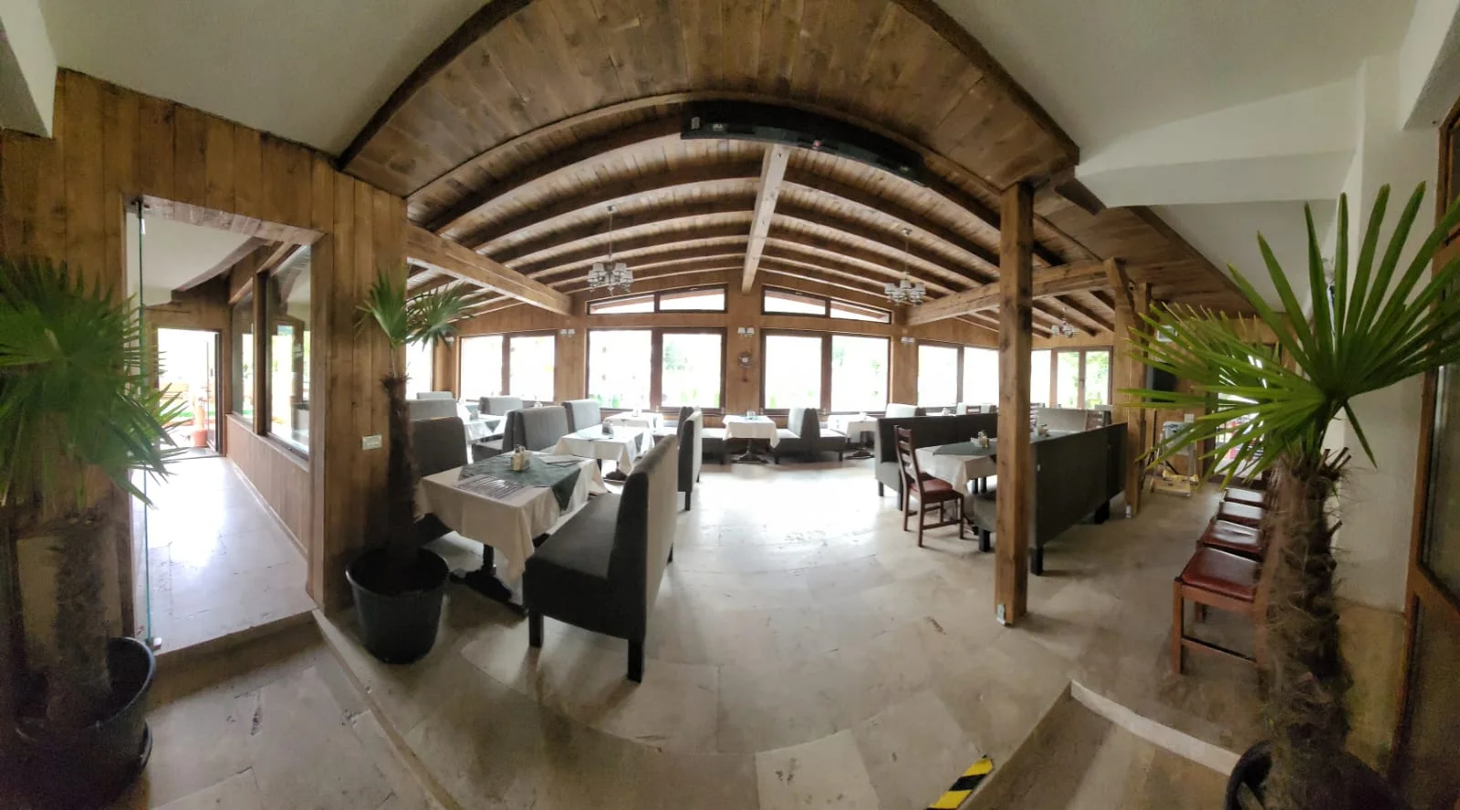 The Elemar restaurant hall, with its wooden ceiling